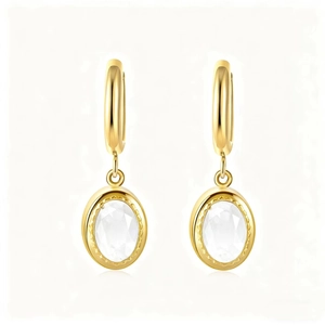Detail of oval white zircon earrings with a polished gold finish and secure clasp closure