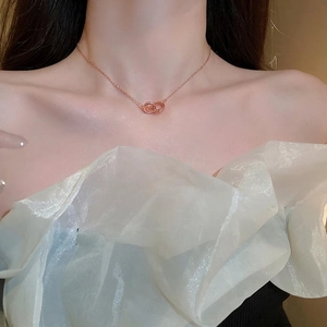 Elegant rose gold butterfly mother of pearl necklace worn on model neck for fashion