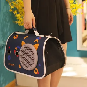 Portable navy blue pet carrier with colorful cat pattern and breathable mesh side