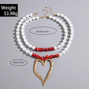 Detailed size specifications for the layered faux pearl and red stone heart necklace