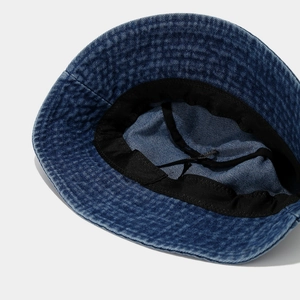 Deep blue washed denim bucket hat interior with adjustable drawstring and sweatband details
