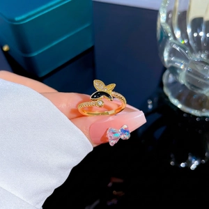 Gold butterfly open ring with sparkling diamonds and black enamel detail for women