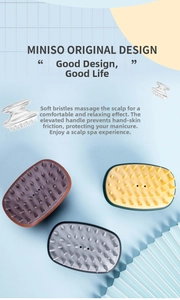 Detail of silicone scalp massager brushes in purple, yellow, and grey with soft cone bristles