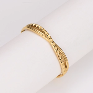 Modern gold wave bangle with triangular relief texture and polished plating finish