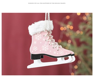 Close-up of pink wooden ice skate Christmas ornament with white faux fur and snowflakes
