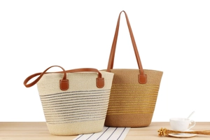 Macro detail of striped woven tote bags with leather straps on a wooden table