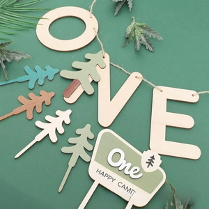 Detail showing natural wood grain on One Happy Camper themed forest birthday cake toppers