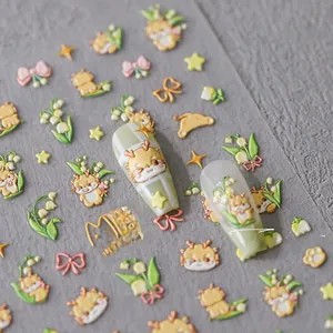 Detail of 3D embossed nail stickers featuring cute dragons, lilies, and stars in yellow