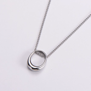 Minimalist silver oval pendant necklace with a fine chain in a sleek metal design
