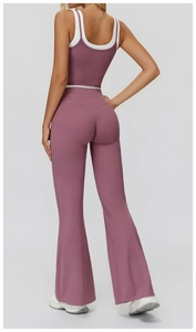 Detailed back view of high-waisted flared yoga pants and racerback sports bra in dusty rose