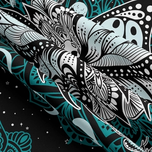 Close-up of bohemian mandala tapestry fabric showing intricate teal and blue floral patterns