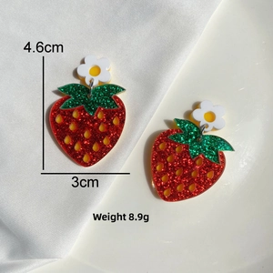 Detail view of strawberry acrylic earrings with dimensions 4.6cm x 3cm and weight 8.9g