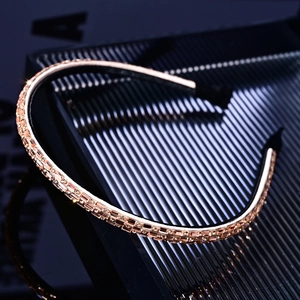 Detailed view of champagne gold sparkling crystal headband with black anti-slip lining