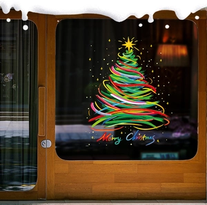 Artistic ribbon Christmas tree and Merry Christmas window sticker on a glass door