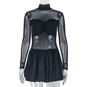 Detail of black mini dress with sheer mesh sleeves and pleated bodice on white background