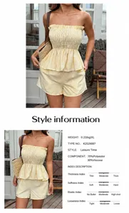 Detail view of yellow striped tube top and shorts set with fabric composition data