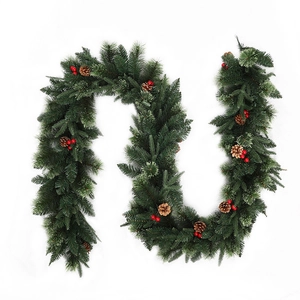 Christmas wreath vine with green pine needles, natural pine cones and red berries on white background