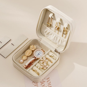 Portable leather jewelry organizer box with functional internal compartments for travel