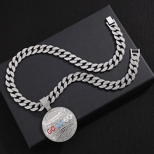 Close-up of diamond-encrusted silver Cuban chain necklace with GO GO GO pendant