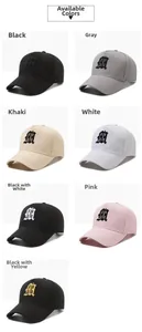 Grid display of cotton baseball caps showing seven color options with gothic embroidery