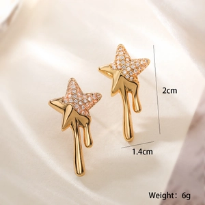 Detailed view of gold star earrings with melted drip design and dimensions 2cm x 1.4cm