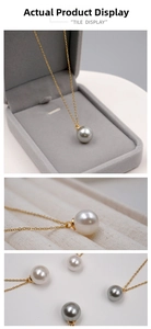 Dettaglio delle collane di perle in bianco e grigio con catena in oro 18 carati