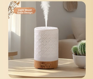 Detail view of white crackle pattern humidifier with light wood grain base and timer buttons
