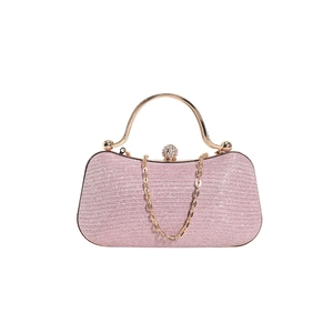 Pink glitter evening clutch bag with golden metal handle and decorative chain link detail