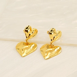 Minimalist double layer heart drop earrings in gold with a liquid metal texture finish