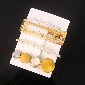 Set of three elegant acetate hair clips with gold foil, pearls and geometric accents