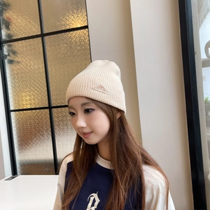 Outdoor street style knitted beanie for winter warmth, featuring mountain embroidery