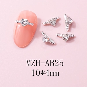 Detailed view of silver heart nail charms with wings and tiny diamonds, size 10x4mm