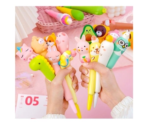 Close-up of cute cartoon squishy gel pens featuring various animal and fruit characters