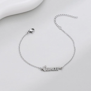 Macro detail of silver Cancer zodiac bracelet with adjustable chain and lobster clasp