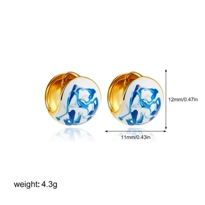 Detailed macro view showing dimensions and 18K gold blue porcelain enamel earrings