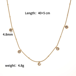 Detail view of 40+5cm gold snake chain necklace with 4.8mm clear zircon pendants