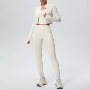 Detailed view of women's 3-piece cream yoga set with zip jacket, vest and high-waist pants