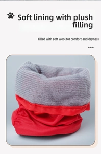 Detail of red waterproof dog boots featuring soft grey fleece lining for warmth and comfort