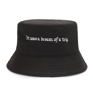 Detail of black cotton bucket hat featuring white embroidery and multi-row stitched brim