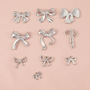 Lot de 10 pendentifs nœuds en acier inoxydable pour création de bijoux sur tissu rose
