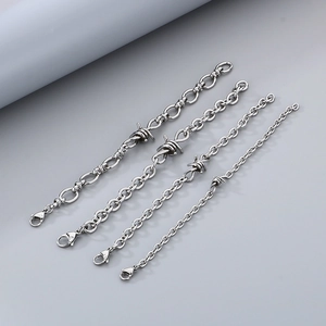 Detail view of four sizes of stainless steel barbed wire bracelets with lobster clasps