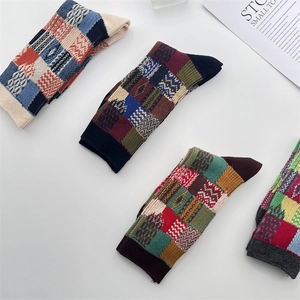 Close-up of retro color-block checkered cotton socks in various vintage patterns
