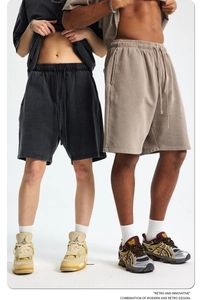 Detailed close-up of heavy cotton sweatpants fabric with elastic drawstring waist detail
