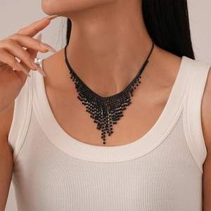 Elegant dark style necklace with black rhinestones and cascading tassel fringe on model