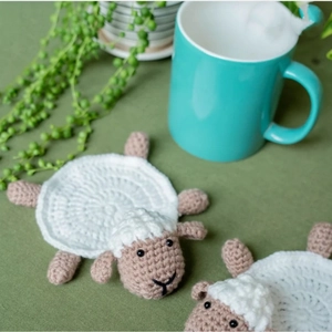 Handmade crochet sheep coasters set in white and beige yarn for table heat protection