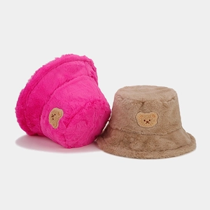 Fuzzy plush bucket hats with cute bear embroidery in vibrant pink and khaki colors