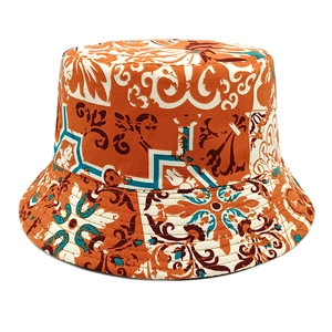 Detailed view of bohemian tie-dye floral print and stitching on the reversible bucket hat