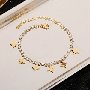 Elegant gold titanium steel bracelet featuring sparkling rhinestones and star pendants