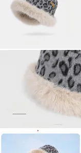 Close-up of leopard print winter hat with plush faux fur trim and windproof ear protection