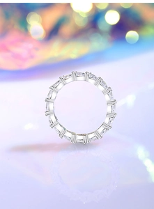 Macro shot of silver sterling ring featuring meticulous prong setting and round zircons